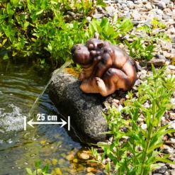 Wasserspeier-Figur sitzendes Flusspferd Hippo